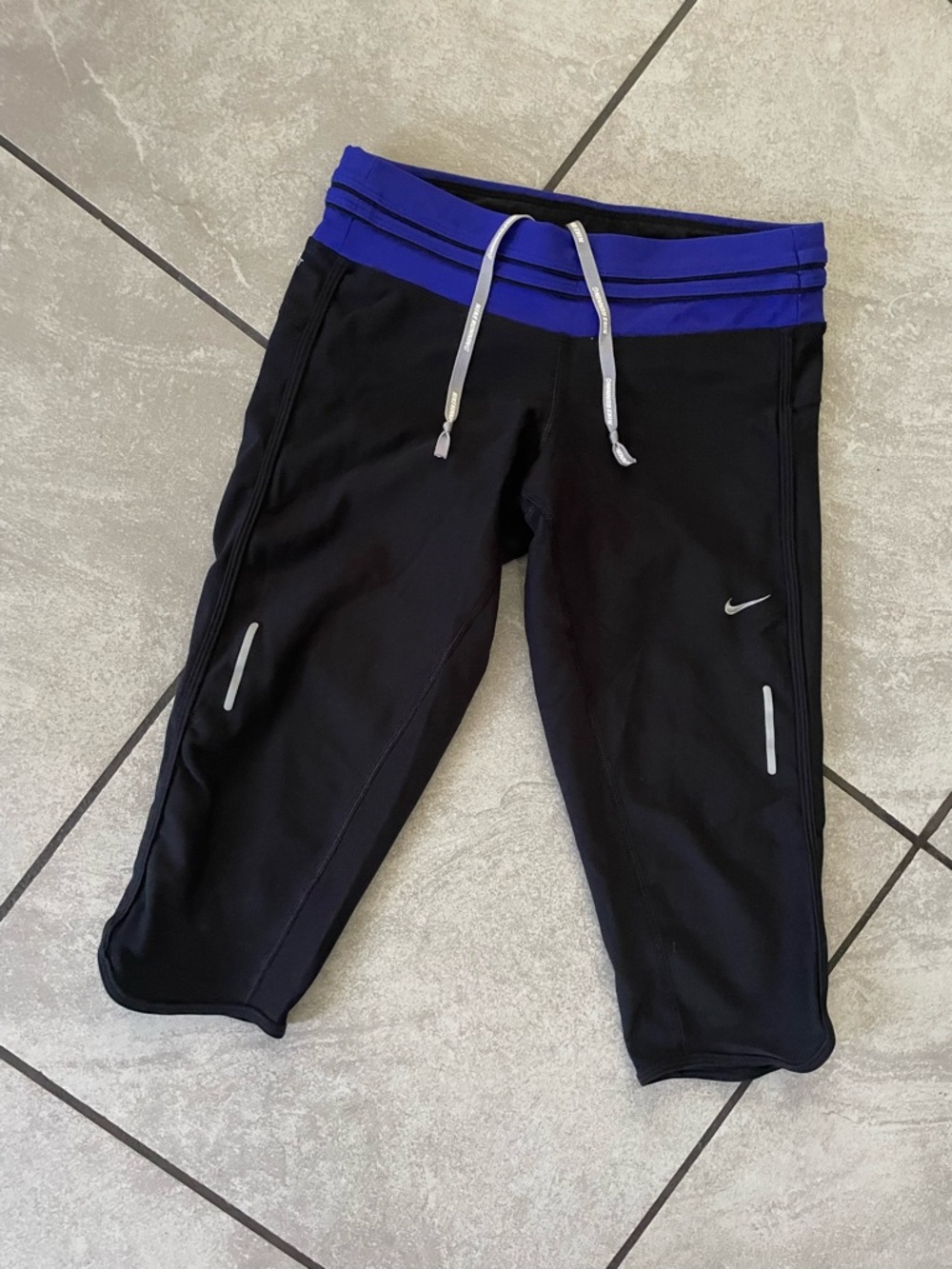 Nike women’s Black Capri Sweatpants with Blue Waistband